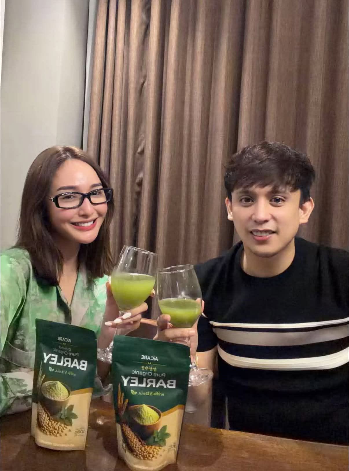 Ms. Sachzna Laparan enjoying a glass of freshly mixed AICARE barley drink at home